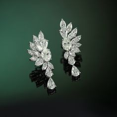 Whenever I visit Amsterdam, the first place I go to is the beautiful and timeless flower markets. I am immediately calmed by the striking display of flowers, bountiful and bursting with life. This is the feeling that I wanted to capture in the design of the Amsterdam Earrings. Delicately crafted with a combination of marquise, oval, and pear diamonds the diamond petals create a stunning structured edge, highlighting the grace and beauty only the Amsterdam Earrings can capture. Luxury Pear-shaped Cluster Earrings For Formal Occasions, Luxury Pear-shaped Cluster Earrings For Formal Events, Classic Flower Shaped Diamond Earrings For Formal Events, Classic Flower Shaped Diamond Earrings For Formal Occasions, Luxury Flower-shaped Formal Earrings, Luxury Flower Shaped Formal Earrings, Classic Formal Flower Shaped Diamond Earrings, Classic Diamond Flower Earrings For Formal Occasions, Classic Formal Diamond Flower Earrings