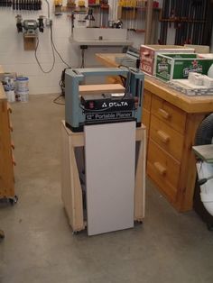 a workbench in a garage with tools on it