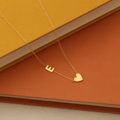 Personalized Initial Letter Necklace, 14K Gold Initial Heart Necklace, Custom Couple Necklace with Heart Symbol, Minimalist Gold Jewelry. This exquisite piece of jewelry allows you to carry the handwriting of someone you love close to your heart. Crafted with care, the heart-shaped pendant is available in high-quality 14K gold, exuding timeless elegance and sentimentality. ✨ Product Details: Material: High-quality 14K gold plated Length: 18 inches with a 2-inch extension for adjustable fit Optio Minimalist Initial Necklace For Valentine's Day, Minimalist Heart Pendant Initial Necklace, Minimalist Yellow Gold Initial Necklace For Valentine's Day, Minimalist Gold Heart Necklace With Initials, Valentine's Day Yellow Gold Minimalist Initial Necklace, Minimalist Initial Necklace For Anniversary, Minimalist Initial Necklace With Delicate Chain For Valentine's Day, Yellow Gold Heart Initial Necklace For Valentine's Day, Minimalist 14k Gold Heart Necklace For Anniversary