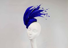 Royal blue fascinator with hand shaped feathers. A stunning headpiece for a day at the races. This hat would look fabulous at Royal Ascot and is Royal Enclosure compliant. Secured with hat elastic which is comfortable and easily hidden. Royal Blue Fascinator, Mother Of The Bride Hats, Hat Tea Party, Blue Fascinator, Ss 2024, Royal Ascot Hats, Ascot Hats, Bride Hat, Tea Party Hats