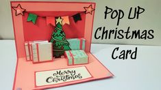 a pop up christmas card with a tree and presents