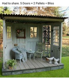 an outdoor shed with chairs and tables on the porch, next to a potted plant