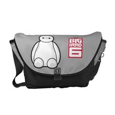 a grey and black messenger bag with an image of a teddy bear