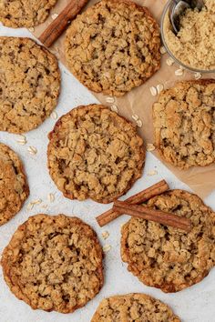 oatmeal cookies and cinnamon sticks on a table