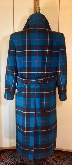 Women's Coat- Blue Plaid Pendleton Coat Teal Turquoise Red Black Career Sleek Double Breasted Classy, Crisp plaid in excellent conditiondouble-breastedbeautiful teal color with red stripes and black 40" around the bust34" around the waist42" around hips22" sleeve sleeve45" in length 17" shoulder to shoulder Blue Double-breasted Outerwear, Fitted Blue Double-breasted Outerwear, Pendleton Coat, Meghan Markle Photos, Teal Turquoise, Double Breasted Coat, Teal Color, Equestrian Style, Vintage Coat