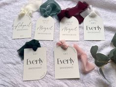 six different types of hair bows are laid out on a bed