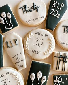 decorated cookies are arranged in the shape of baseball bats and numbers for 30th birthdays