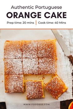 orange cake with powdered sugar on top and slices cut out to be served for dessert