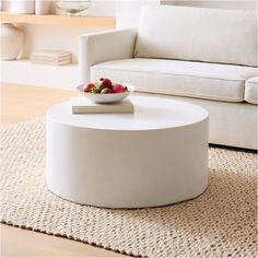 a white coffee table sitting on top of a rug