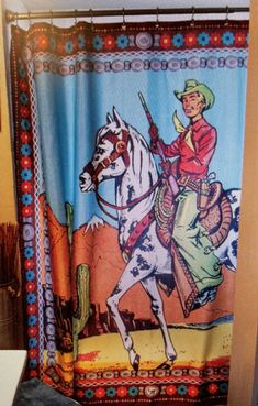 Bring some of your favorite Fringe Scarf designs HOME! The Ranger in brown is a new scarf design this season and now one of eleven different shower curtain designs to help liven up your bathroom. We love the Ranger in brown for a fun retro vibe or an addition to your little cowgirl or cowboy's bathroom, or for just plain old fun! The perfect baby gift! Also available in Pink *100% polyester - machine washable. Iron on polyester setting. Comes with set of silver shower rings. Size - 70” x 70.5”. Southwest Shower Curtain, Cowboy Bathroom, Western Interior Design, Cowboy Shop, Western Interior, Cabin Interior Design, Scarf Designs, Shower Rings, Rodeo Cowgirl