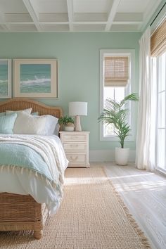 a bedroom with green walls and white bedding in the center is decorated with wicker furniture