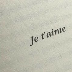 the word je t'aime written in black ink