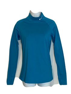 a women's blue top with white trims on the sleeves and neckline