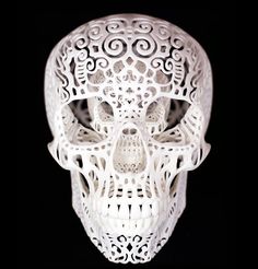 a white skull with intricate designs on it's face