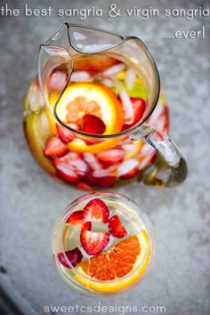 a pitcher filled with liquid and sliced fruit