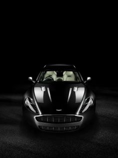 a black car with the words aston martin above it