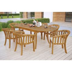 a wooden table and chairs on a deck