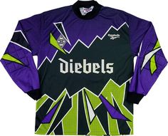 the jersey is purple and black with green accents