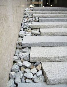 stone steps are lined up against the wall