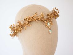 A whimsical elven fairy crown in beautiful tones of gold. Thanks to the use of artificial leaves, the crown is durable. It is a special touch to your bohemian look. A flower crown is more beautiful than the pictures. Is perfect for garden wedding. Head circumference: one size fits all (adjustable) / fits adults and older children If the crown should fit the baby, after buying please give head circumference We offer customized accessories, matching the floral crown. Here you can buy a matching floral boutonniere: https://www.etsy.com/listing/672949700/customized-flower-boutonniere You can also buy a fitted flower comb: https://www.etsy.com/listing/696659747/customized-flower-comb or a matching floral bracelet: https://www.etsy.com/listing/686638755/customized-flower-bracelet Thank you for v Golden Elf, Gold Leaf Crown Greek, Golden Vine Crown, Gold Structured Crown Fantasy Headpiece, Golden Leaf Crown, Laurel Wreath Crown, Gold Laurel Wreath, Gold Leaf Crown, Gold Leaf Headband