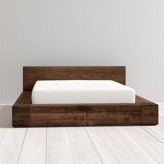 the bed is made up and ready for someone to use it in their home or office