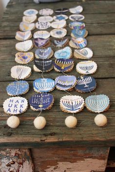 many decorated cookies on a wooden table