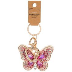 a key chain with a pink butterfly on it's front and back ends, in the shape of a heart