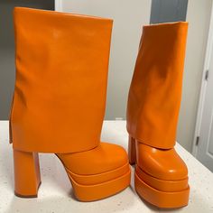 Orange Leather Boots Size 6 Spring Mid-calf Boots With Platform In Faux Leather, Spring Mid-calf Platform Boots In Faux Leather, Bold Leather Ankle-high Heels, Bold Boots With Reinforced Heel And Round Toe, Leather High Heel Mid-calf Boots With Chunky Platform, Bold Leather Ankle Boots, Leather Mid-calf Boots With Chunky High Heel, Bold Heeled Boots With Platform And Round Toe, Bold Platform Heeled Boots With Round Toe