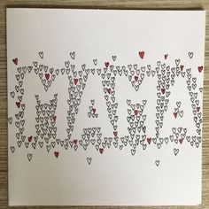 a card with hearts that spell out the word love