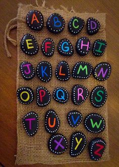 the letters and numbers are made out of felt on a burlocked sack