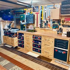 a workbench with many drawers and tools