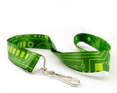 Be a gifting hero for your favorite technophile! I designed the imagery for this awesome lanyard based on the circuit boards I'm surrounded by. The lanyard is digitally printed from edge to edge on a smooth, synthetic fiber and is colorfast (won't bleed). The band is one inch wide and 35 inches (90cm) long. The end is outfitted with a swivel clip to hold your badge, ID, or keys. If you need more (office gifts?), please get in touch for corporate gift pricing. All items are shipped in a black cot Christmas Tech Gifts, Technology Classroom, Circuit Board Design, Pink Heart Necklace, Popular Earrings, Technology Gifts, Signature Necklace, Engineering Gifts, Sterling Silver Heart Necklace