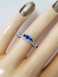 "Thanks for shopping our vintage estate store. We tend to sell well below wholesale and truly hope you enjoy all of our items. Many of the items are one of a kind, so please enjoy scrolling through the pictures and hopefully something will catch your eye. Nice estate sterling silver 925 created or synthetic sapphire .50ct cz diamond cocktail ring. Just stunning. Custom made from our shop. Retails $89 on sale $39 Ring size: please select a size Setting: 5/8\" 14mm by 1/4\" 6mm Band weight: 2mm We Vintage Blue Cubic Zirconia Rings, Hallmarked Sapphire Birthstone Promise Ring, Sapphire Birthstone Hallmarked Promise Ring, Anniversary Blue Diamond Ring With Vs Clarity, Antique Cocktail Ring, Antique Rings Vintage, Diamond Princess, Diamond Cocktail Rings, Princess Diamond