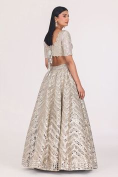 Silver attached cancan lehenga with zari thread, mirror work in chevron pattern and gota embellishment. Paired with cutwork embroidered padded blouse and dupatta. - Aza Fashions Wedding Dress With Motifs And Floor-length, Festive Wedding Dress With Motifs, Wedding Sets With Motifs In Floor-length, Wedding Sets With Motifs And Floor-length Design, Floor-length Wedding Sets With Motifs, Semi-stitched Lehenga With Motifs For Celebration, Celebration Lehenga With Motifs Semi-stitched, Celebration Semi-stitched Lehenga With Motifs, Festive Lehenga With Motifs For Celebration