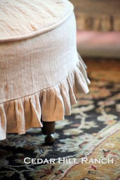 a close up of a foot stool on a rug