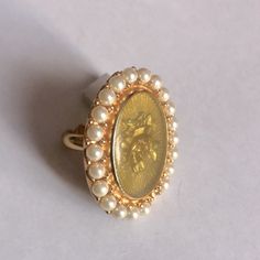 Vintage Dior Pearl Ring With Golden Rose. Size Is Adjustable. Over 20 Years Old. True Dior Lover Piece. Just Removed From Storage. Ring Only No Dust Bag Or Dior Box. Will Ship In A Plain White Ring Box Price Tbd Luxury Cabochon Pearl Ring For Wedding, Luxury Cabochon Pearl Wedding Ring, Gold Cabochon Pearl Ring For Wedding, Gold Pearl Cabochon Ring For Wedding, Formal Oval Rose Gold Pearl Ring, Elegant Cameo Rings, Gold Oval Pearl Ring For Wedding, White Ring Box, Vintage Pearl Ring