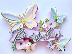 there are two butterflies on top of the word pastel with flowers and butterflies around it