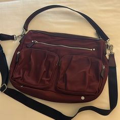 Mz Wallace Crossbody Bag With Shoulder Strap. Bag Is Burgundy/Maroon In Color With Silver Hardware And In Excellent Condition. Bag Is Made Of Bedford Nylon With Leather Trim And Interior Color Is Tan. Bag Includes Two Large Pleated Pockets In The Front With One Large Zipper Pocket In The Front And Back. Length 14’ Height 11’ No Stains Or Marks On This Bag, Includes Dust Bag. Mz Wallace, Tan Bag, Shoulder Strap Bag, Strap Bag, Interior Color, Leather Trim, Silver Hardware, Crossbody Shoulder Bag, Colorful Interiors