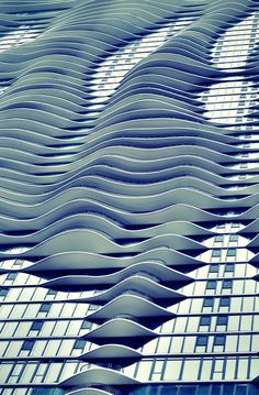 an image of a building that looks like waves