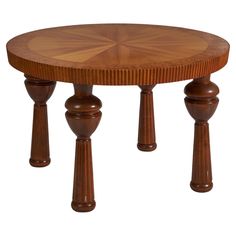 a round wooden table with three pillars on each side