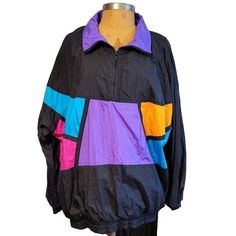 Vintage 90s Womens Natural Issue black and multicolor windbreaker jacket. This is a blast from the past with this late 80s early 90s look. Has inner layer for soft comfort. Excellent shape, only flaw noticed is a string near zipper as shown. Women's XL would fit men's large. 90s Style Multicolor Winter Track Jacket, 90s Inspired Multicolor Long Sleeve Outerwear, 90s Style Black Outerwear For Spring, Trendy Multicolor Long Sleeve Windbreaker, 90s Style Black Hooded Windbreaker, 90s Black Hooded Windbreaker, Black 90s Style Hooded Windbreaker, Black Retro Windbreaker, Black Long Sleeve Retro Windbreaker