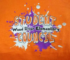 an orange t - shirt with the words student council and paint splatters on it