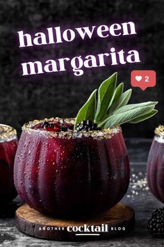 three glasses filled with red liquid and topped with green leafy sprigs, blackberries