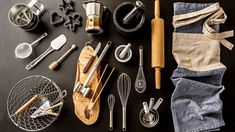 various kitchen utensils laid out on a table