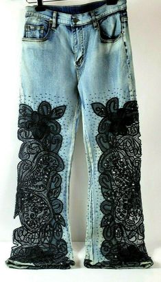 the jeans are decorated with black lace