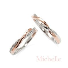 two white and rose gold wedding rings with diamonds on each side, set against a white background