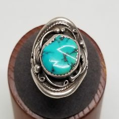 Vintage DV Darrell Victor Sterling with Turquoise Ring, Size 10. Marked DV sterling behind stone. Stone is 15 x 13mm. Ring is 32mm wide. Weighs 0.44 ozt.  We do not check prongs for wear or stones for looseness.  All items are sold as is-noting that we are a resale shop  so everything here had a previous owner! We will include flaws in the description when noted. This is one of the reasons our items are more affordable than new at a jewelry store. Are these stones real or fake? Aside from diamonds, we do not know if any gemstones are natural or synthetic. We will state on certain gemstones, that we know 100%, if they are created or fake due to their lack of inclusions. For this reason, we do not sell any diamonds without inclusions, and the larger diamonds (half ct+) are soft graded. In re European Jewelry, Vintage Fine Jewelry, Star Sapphire, Pure Gold, Selling Jewelry, Jewelry Store, Rings Statement, Turquoise Ring, Jewelry Stores