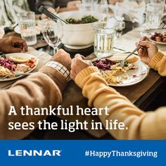 people sitting at a table with plates of food in front of them and the words, a thanksgiving heart sees the light in life