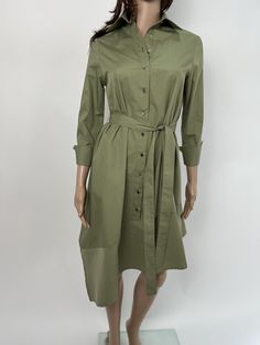 Shirt dress with a loose A-line silhouette and 7/8 sleeves with cuffs in a pleasant and modern green color. The dress is asymmetrical, fastens to the placket. It has a removable belt to emphasize the waist. It can be worn with or without a belt. A comfortable dress for leisure and the city. Light and pleasant cotton fabric. It can be combined with elegant shoes or sneakers. Composition and care: Fabric - cotton, polyester, elastane Wash at 40 degrees, do not tumble dry Ironing at moderate temper Avant Garde Dress, Avant Garde Dresses, Below The Knee Dresses, Jumpsuit Fitted, Dress Knee Length, City Dress, Belted Shirt Dress, Elegant Shoes, Loose Shirts