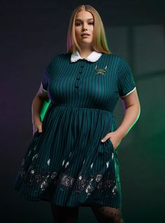 This striped, collared dress captures all the playful creepiness of The Haunted Mansion. It's green like the wallpaper, has an embroidered design of the gargoyle candelabra on the chest, and bat buttons going down the bodice. On the skirt, you'll find framed images of the mansion's most infamous spirits. Plus Size Wizard Of Oz Costumes, Glenda Dress Wizard Of Oz, Plus Size Villian Costume, Charlottes Web Fancy Dress, Mad Hatter Costume Female Plus Size, Disney Villan Costumes For Women, Plus Size Encanto Costume, Large Family Halloween Costumes Disney, Plus Size Halloween Costumes Halloween Costumes